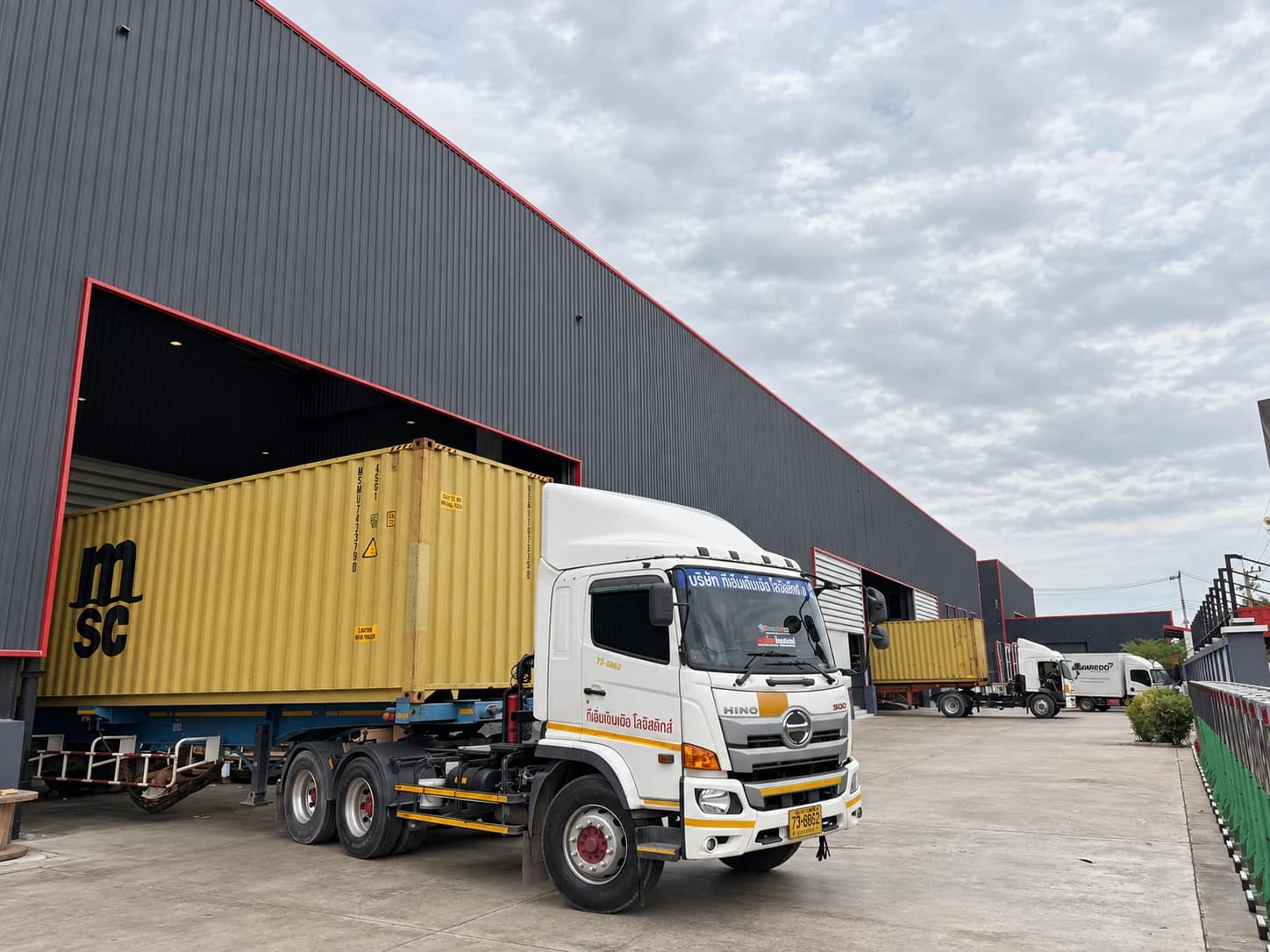 Container trucks at the loading bays of Lavaredo’s factory in Thailand